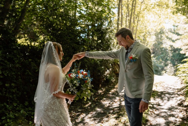 Candid first look moment between bride and groom